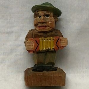 This Vintage ANRI Carved Wood Musician Statue from Italy is a unique and charmin